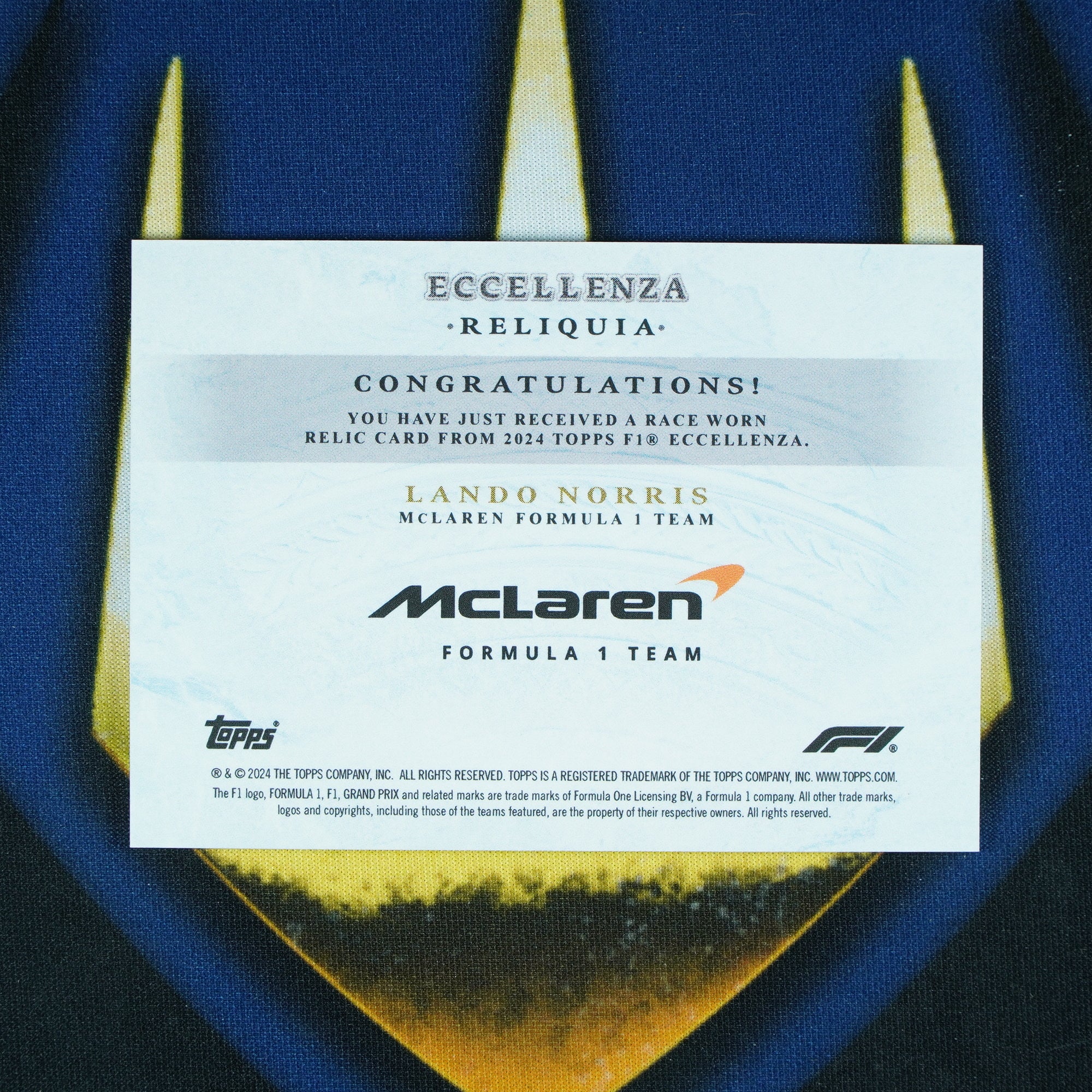 Lando Norris 2024 Topps Eccellenza Reliquia Jumbo Patch /49